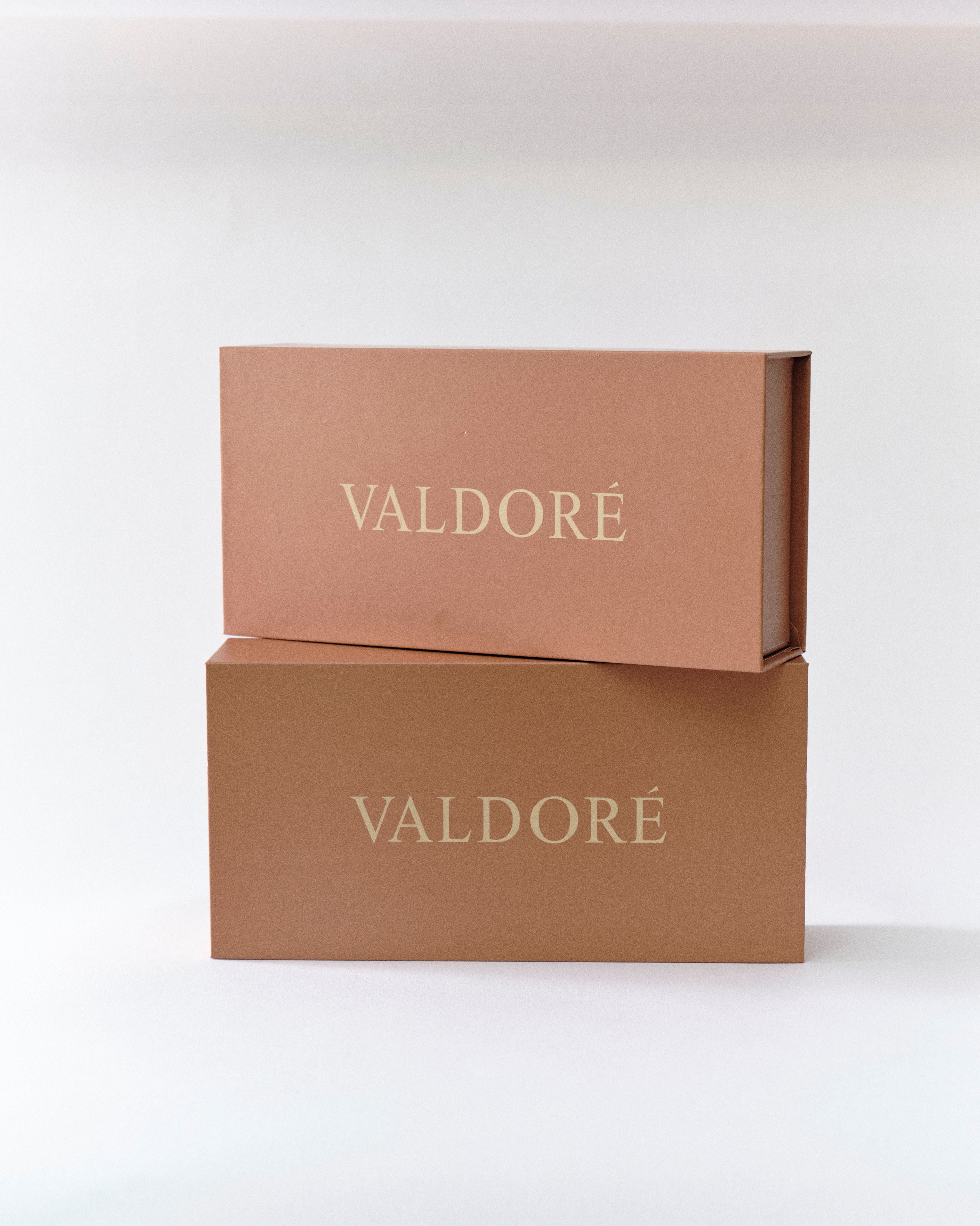 Two brown boxes with 'VALDORÉ' branding on a white background